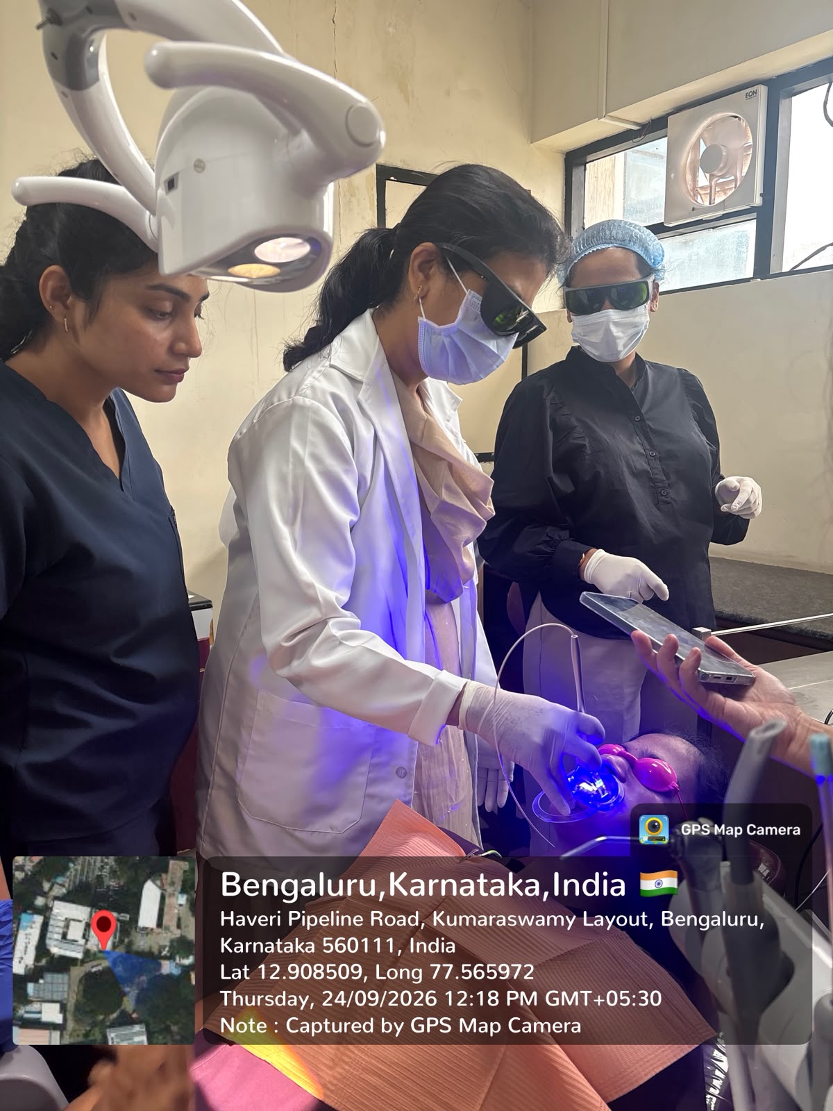 Faculty and clinicians performing laser dental treatment